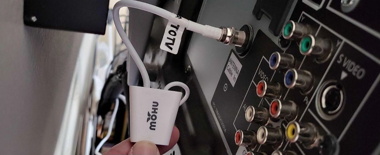 Properly connected Mohu Leaf The Mohu Leaf 50's cables, properly connected to a TV's antenna-in port.