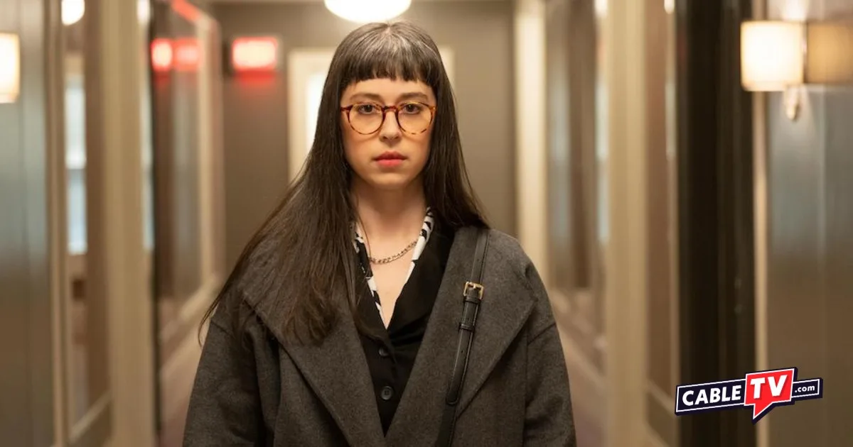 A scene with Poppy/Becky (Adina Verson) standing in the hallway from Only Murders in the Building.