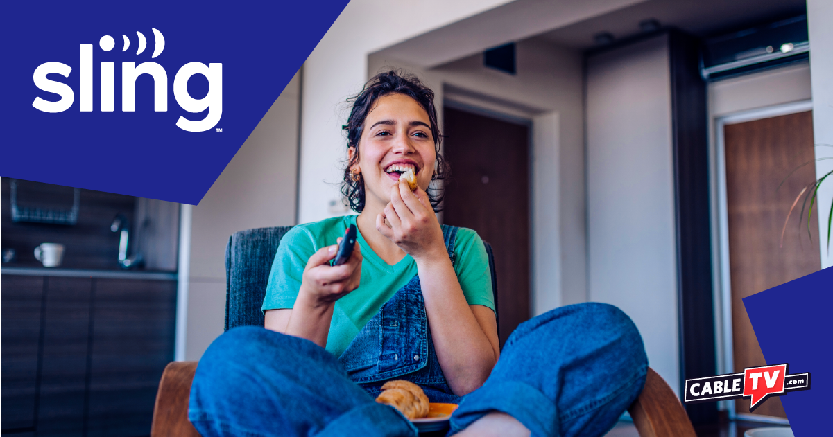 Woman eating snacks while holding remote control