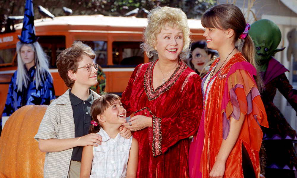 The three main siblings of Halloweentown with their grandmother, played by Debbie Reynolds.