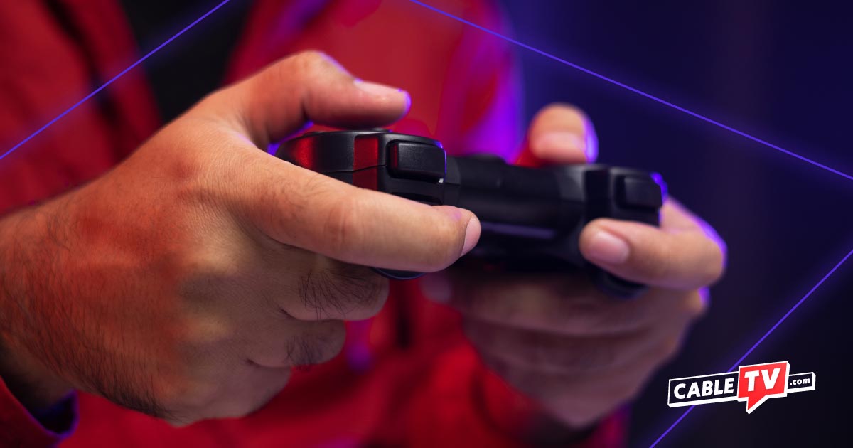Close up of a person's hands holding a video game controller