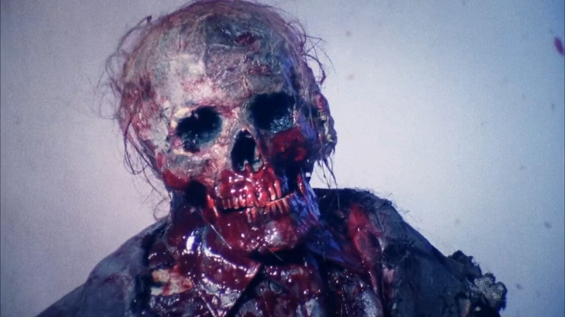 A skeletal zombie covered in blood.