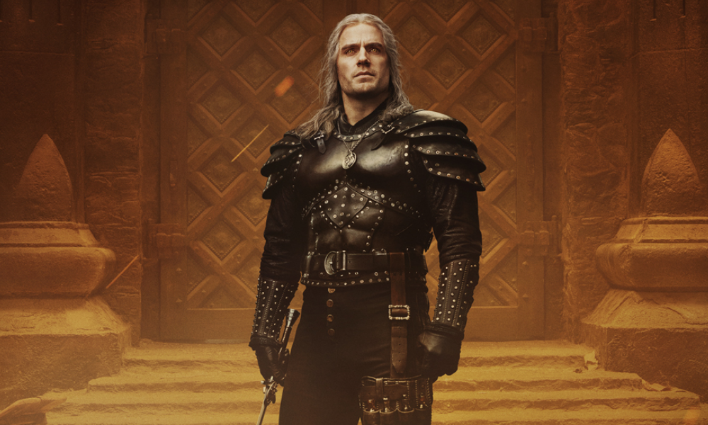 Geralt, a white-haired muscular man in a black suit of armor.