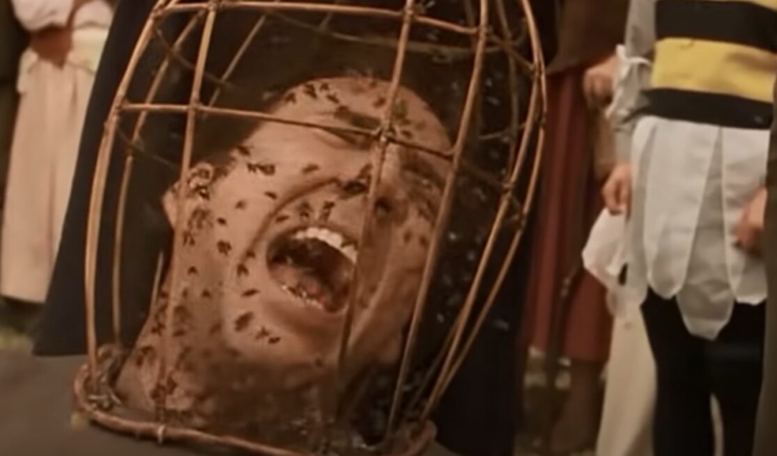 Nicolas Cage screams in pain as bees pour onto his face in The Wicker Man