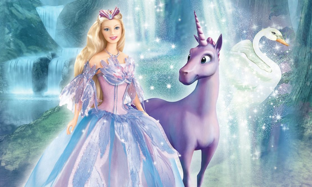 Barbie in a pink and blue dress with swan motifs standing next to a purple unicorn.