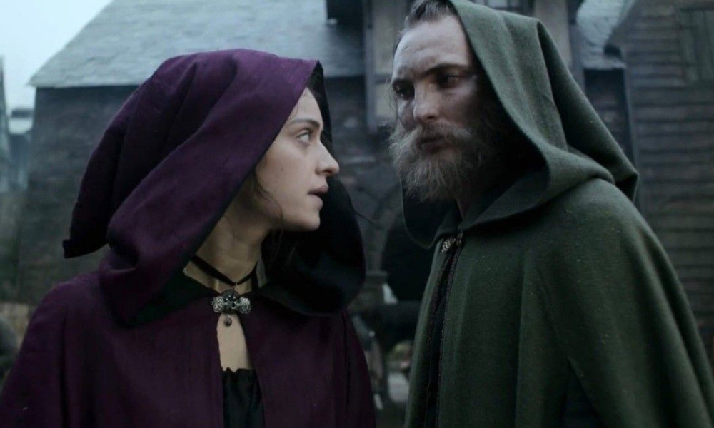 Yennefer, a woman in a purple cloak, and Cahir, a man in a green coat. They match!