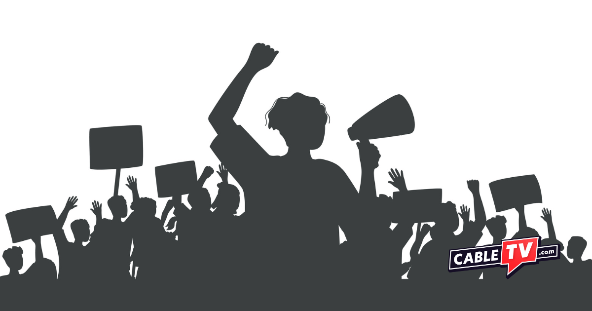 Silhouettes of people striking