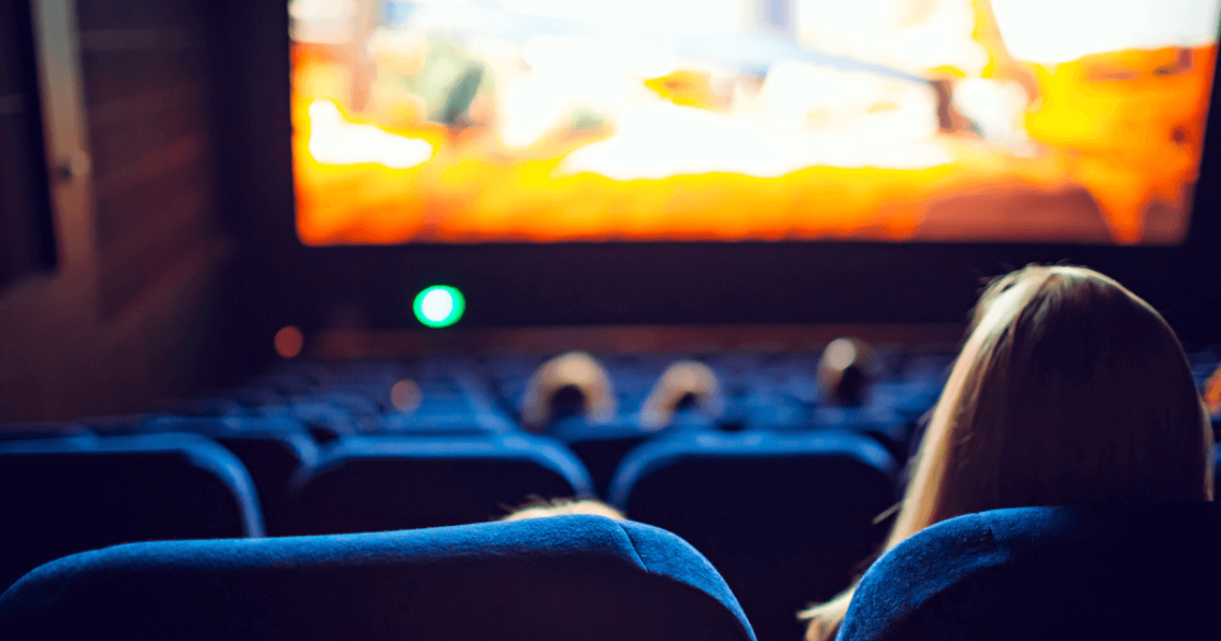 Stock image of people watching a movie in a theater