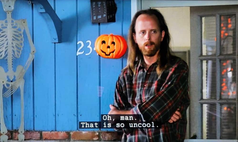 Best Halloween TV Episodes - Freaks and Geeks High school counselor Jeff Rosso watches students speed off after they smashed his jack-o’-lantern in one of the Best Halloween TV episodes from Freaks and Geeks.