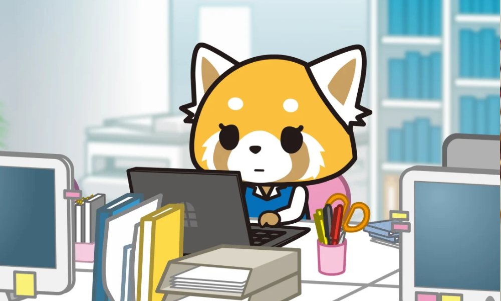 A cute yellow-colored red panda in business clothes sits in her office, looking at her laptop.