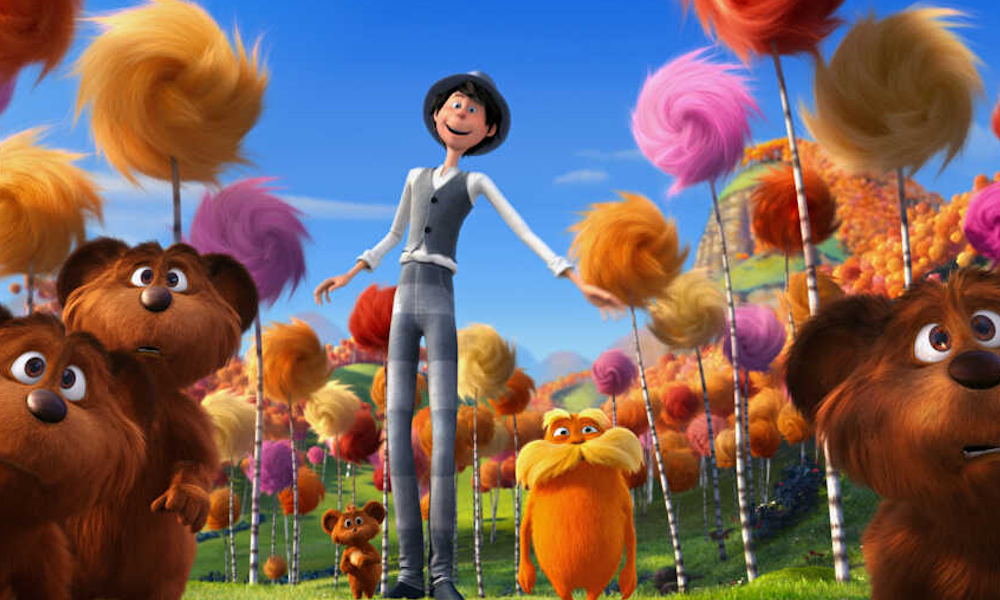 Animated still shot of tall man with the Lorax among fluffy trees