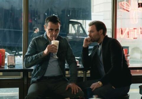Two men chat in a diner
