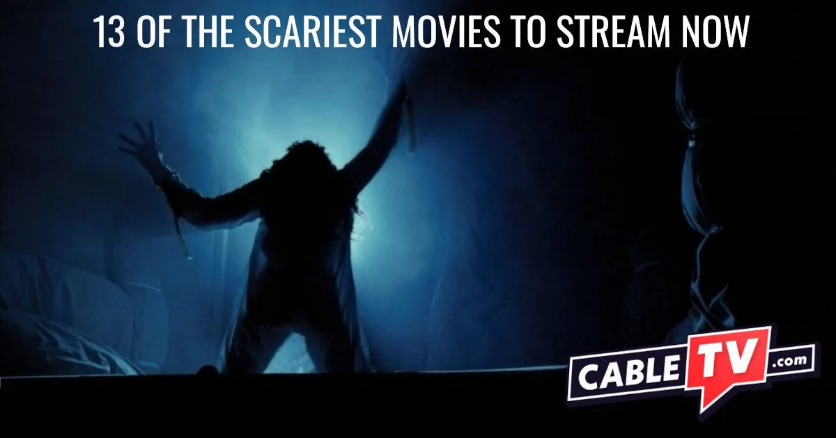 A backlit shot of a foggy room where, on a bed, a demon-possessed young woman claws at the air.
