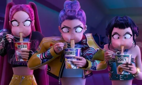 KpopDemonHunters Screenshot of three animated women with exaggerated expressions slurping up personalized cups of ramen.