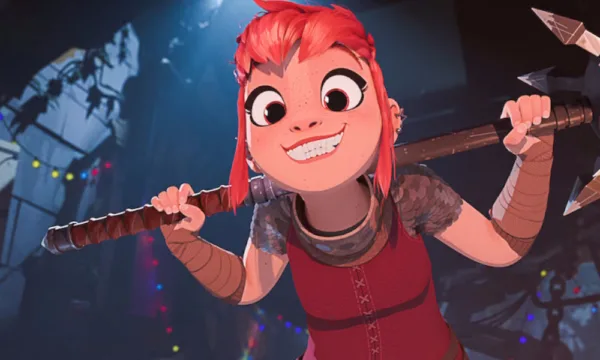 Nimona An animated girl with red-orange hair holds a weapon while smiling at the camera.