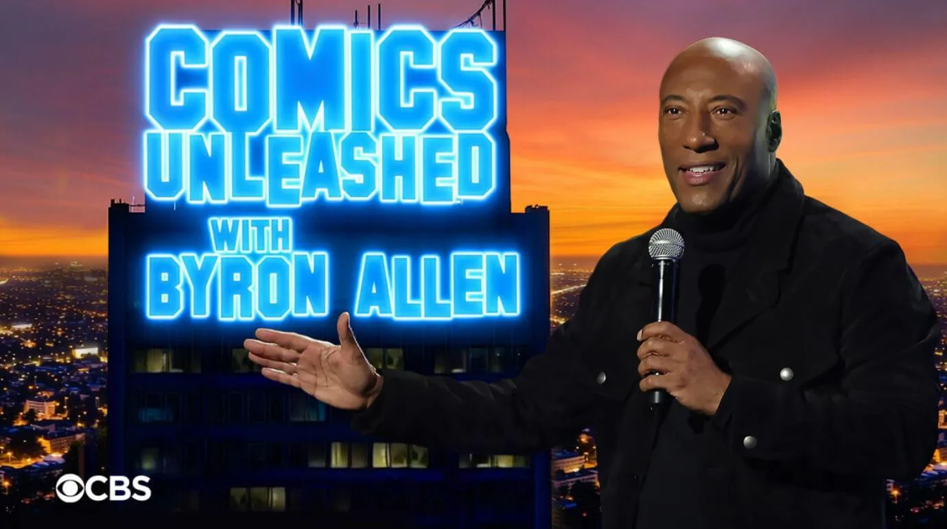 comics unleashed with byron allen (1) A promotional image for Comics Unleashed with Byron Allen shows the host, plus the logo in neon lights, in front of a blurry cityscape at sunset.