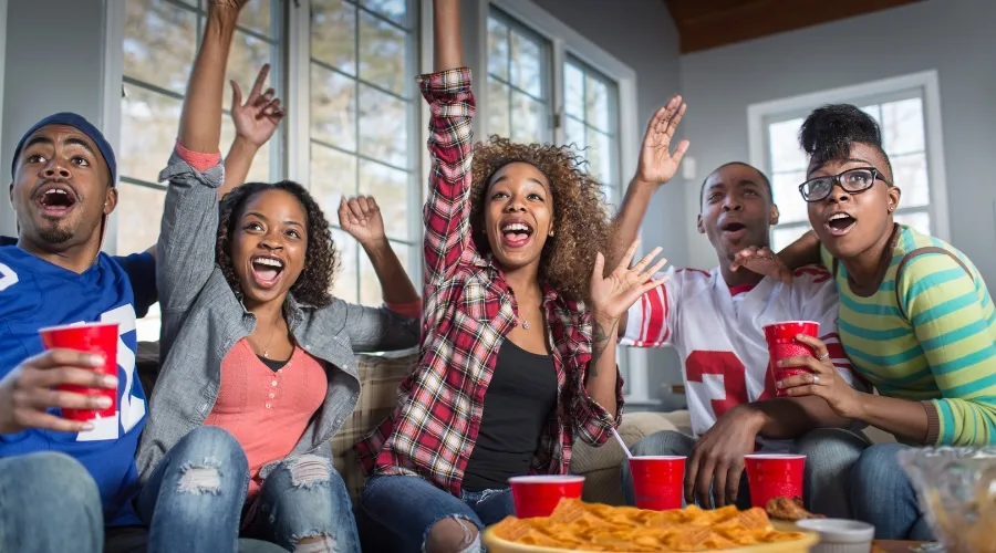 Cheering fans streaming the game with T-Mobile 5G Home Internet