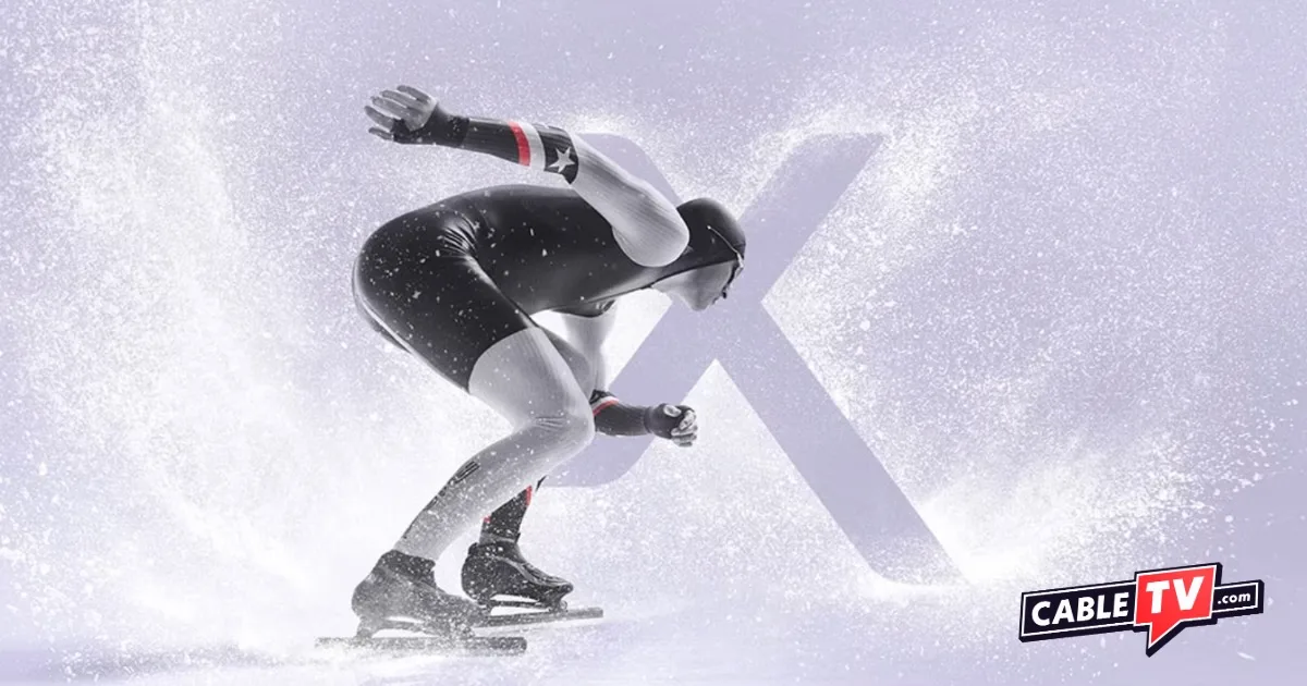 An Olympic speed skater rushes past the Xfinity 'X' logo.
