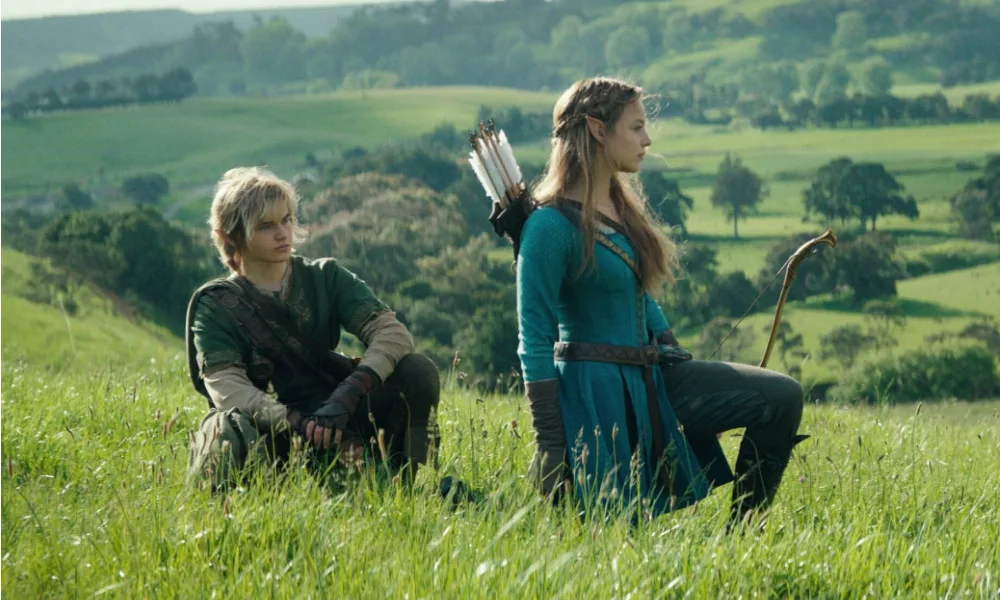 LegendOfZeldaMovie1000xx600 Actors portraying Link and Zelda crouch down in the grass.