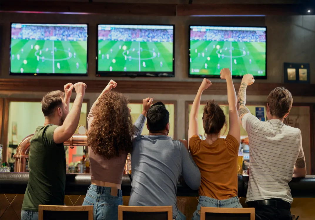cheering-friends-of-soccer-fans-in-the-pub-2026-03-13-04-11-27-utc