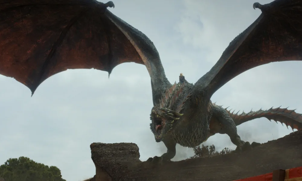 Drogon1000x600 Daenerys riding a red and black dragon.