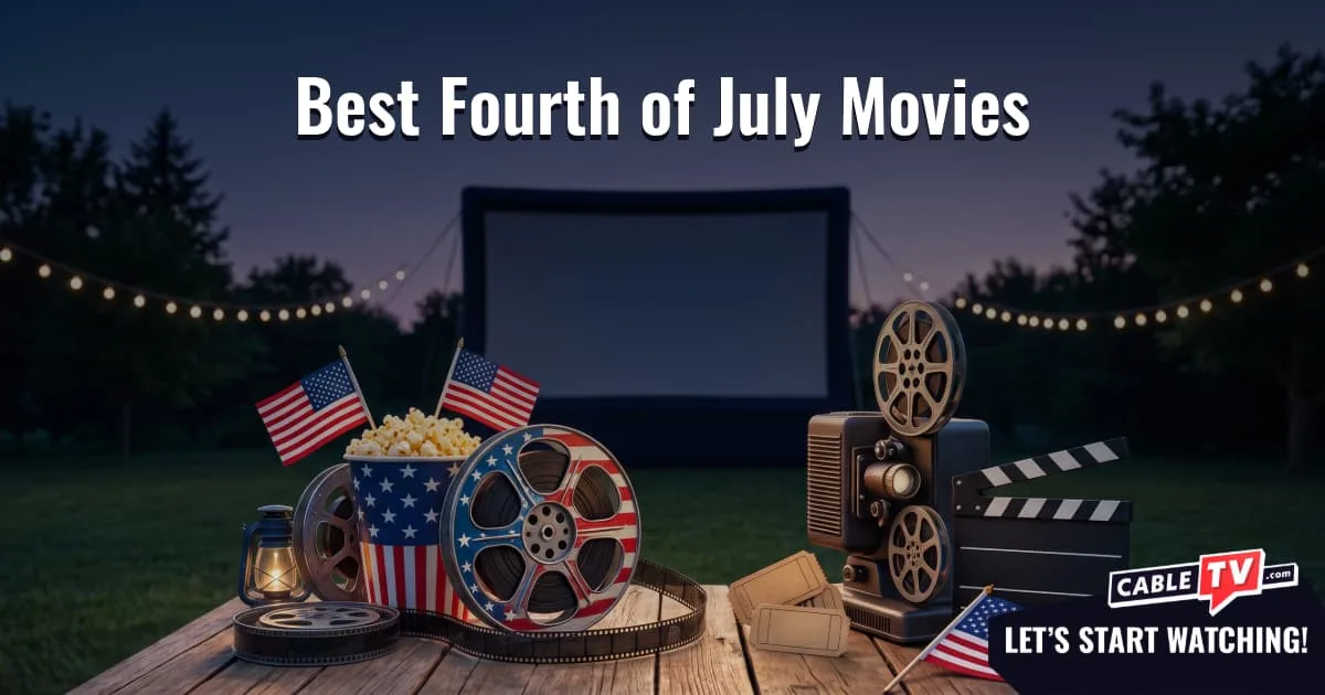A backyard movie setup at dusk featuring a blank outdoor screen behind a wooden table holding a vintage projector and a patriotic popcorn bucket.