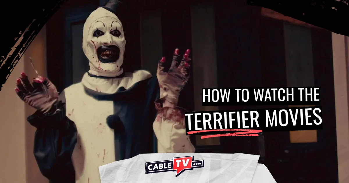 Horror slasher Art the Clown raises his hands, one holding a scalpel, in fake surprise in Terrifier.
