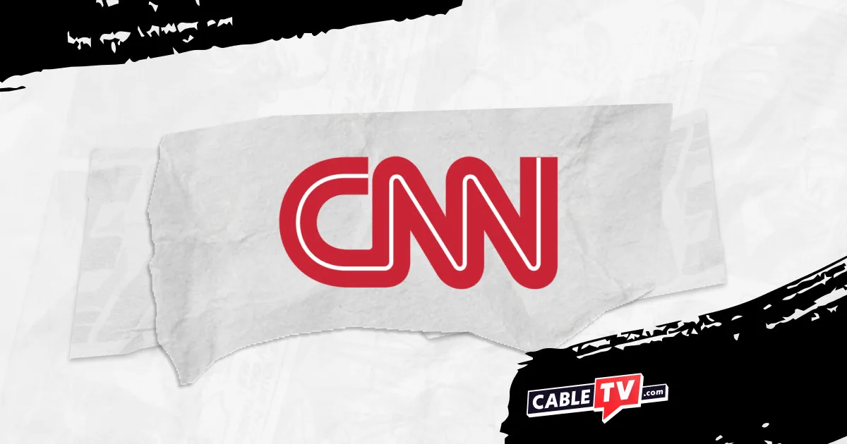 The CNN logo on a torn gray paper banner against a pale newspaper collage.