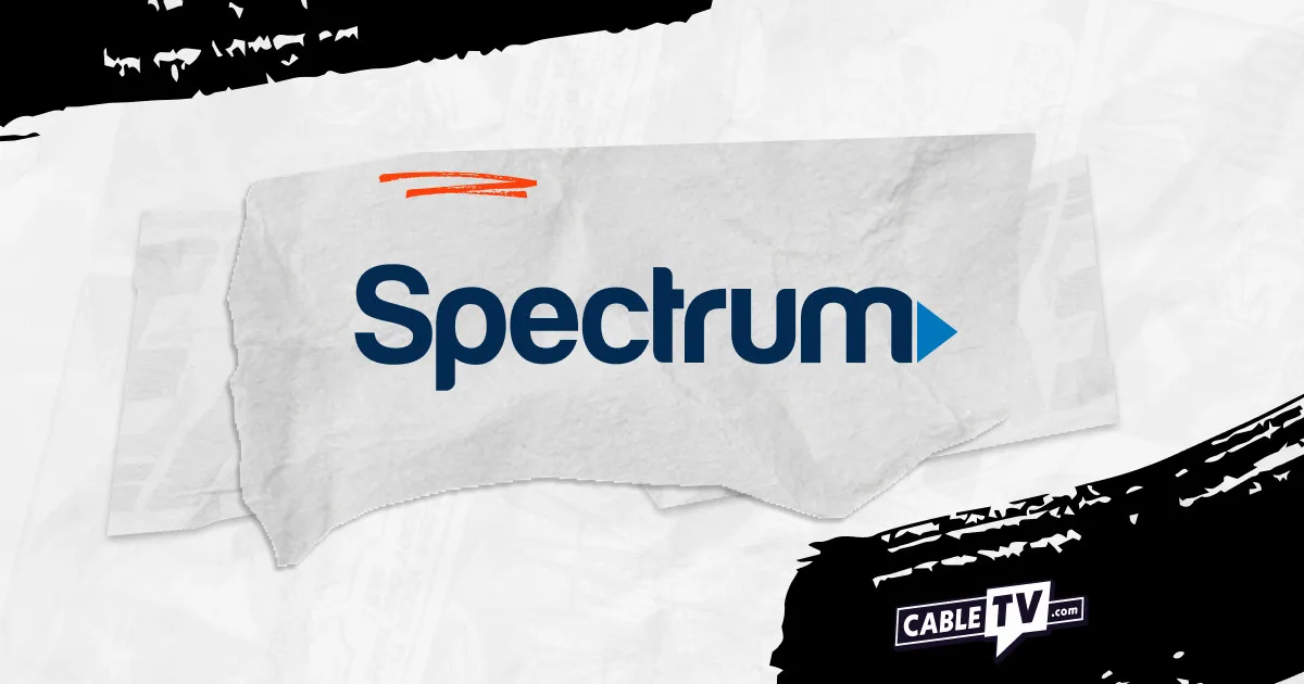 the spectrum logo on a grey and black background