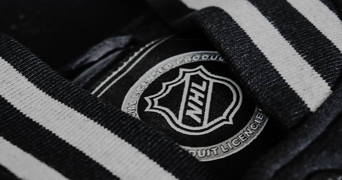 The NHL logo on a black varsity jacket.