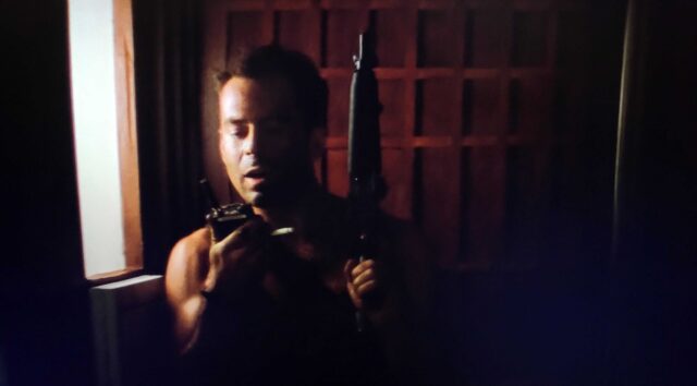 John McClane (Bruce Willis) in a scene from Die Hard.