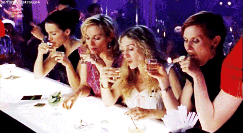 Sex and the City GIF of women taking shots
