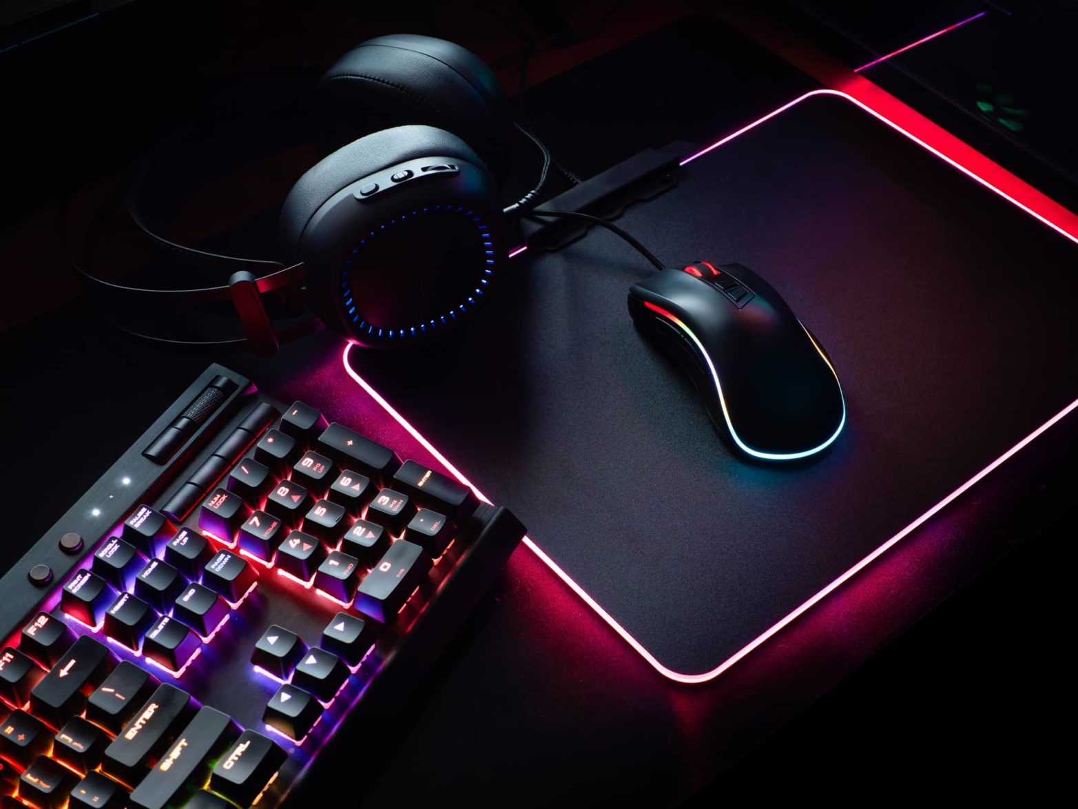 gaming keyboard headphones and mouse glowing